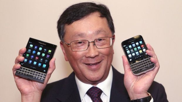 John Chen showing the BlackBerry Passport (left) and Classic (right)