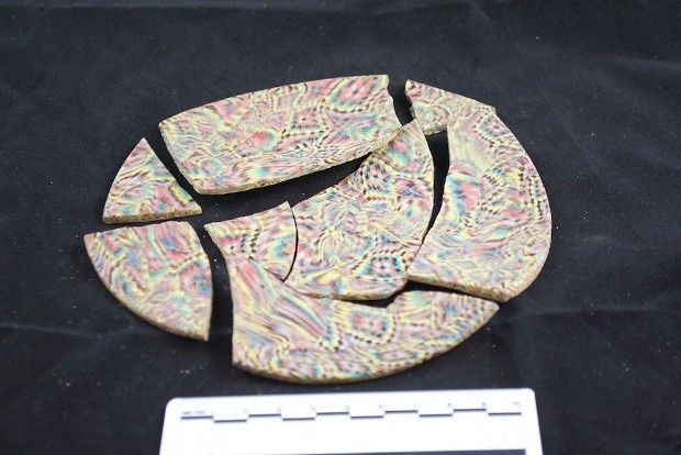 Colorful dishes were also found inside the burying place