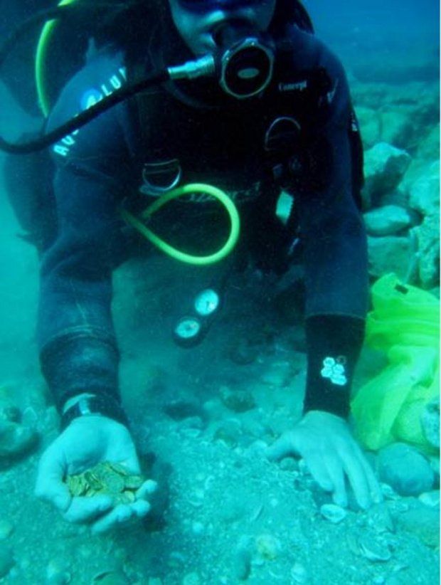 The coins were found by divers exploring an ancient harbor