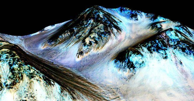 Dark narrow streaks flowing down Martian slopes