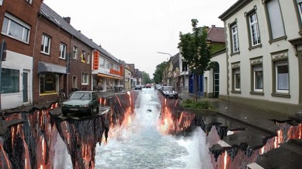 A peaceful street is flooded by water flowing over lava