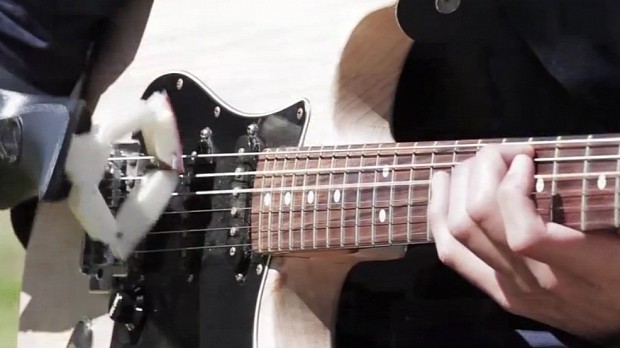 3D printed prosthetic plays the guitar
