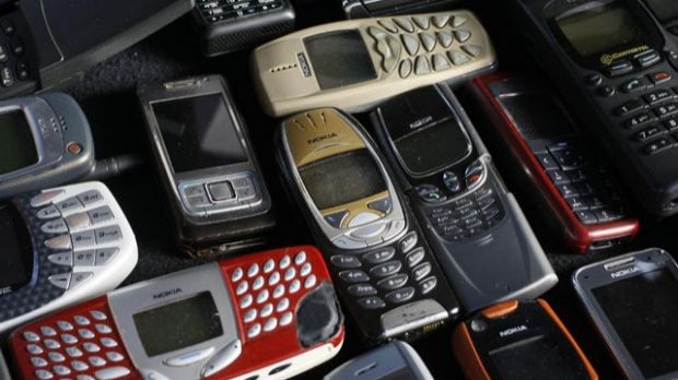 A cluster of old Nokia phones