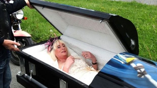 Woman arrives at her wedding in a coffin