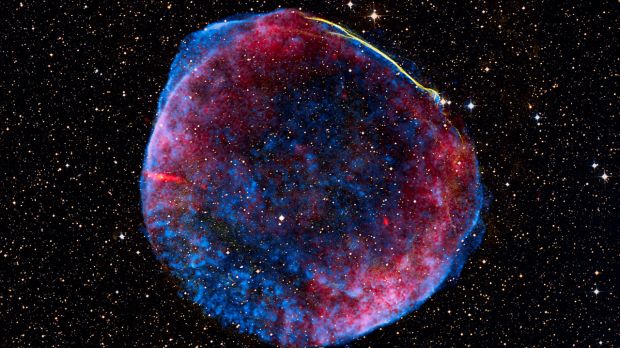 A composite (radio - red, X-ray - blue, and visible light - the yellow stripe) image of supernova SN 1006, used in the study