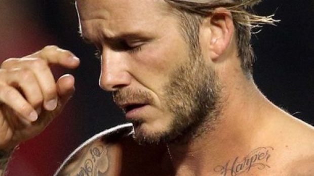 David Beckham shows off Harper tattoo on his collar bone
