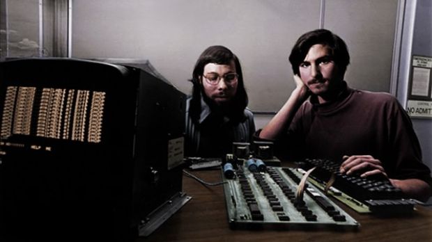 Colorized: Steve Wozniak (left) and Steve Jobs having their picture taken with a fully working Apple 1 computer (1976)