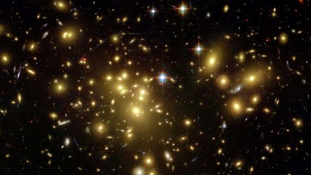 Image of a distant galaxy cluster, obtained through gravitational lensing