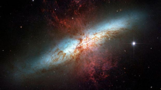 M82 is a bright galaxy located approximately 12 million light years away from Earth, in the direction of the Ursa Major constellation