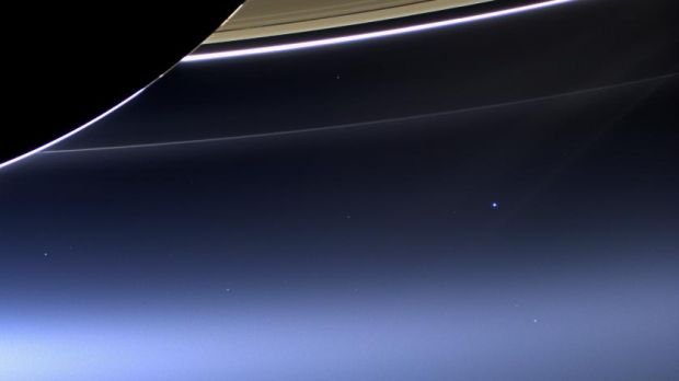 Earth seen from Saturn. Our planet is the blue-ish dot to the center-right of the image