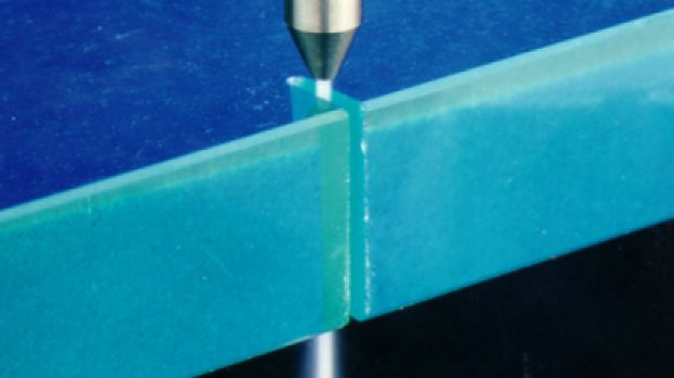 Image of a water jet cutter during operation