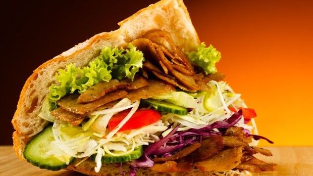 The doner kebab is a Turkish dish made of meat cooked on a vertical rotisserie