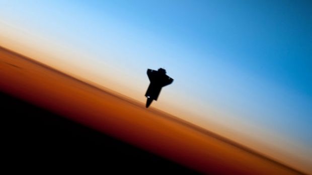 Endeavor is seen here backdropped by the Earth's horizon line, as it prepare to make its final approach to the ISS