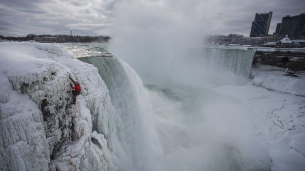 Man scales frozen Niagara Falls