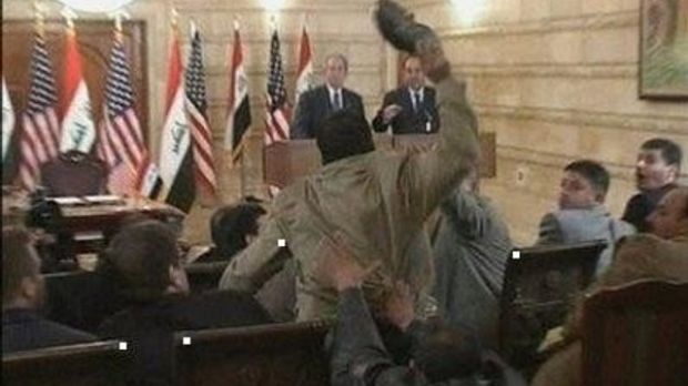 Journalist Muntazer al-Zaidi throws one of his shoes at president George W. Bush, during the former president's last visit to Iraq