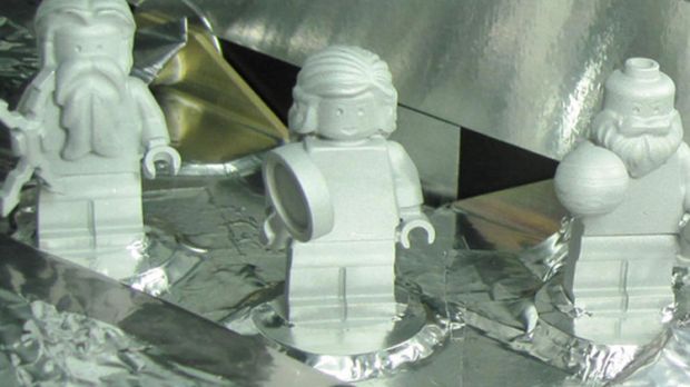 Three LEGO figurines representing the Roman god Jupiter, his wife Juno and Galileo Galilei are shown here aboard the Juno spacecraft