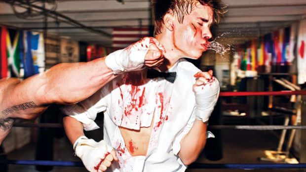 Justin Bieber gets punched in the face in new photospread