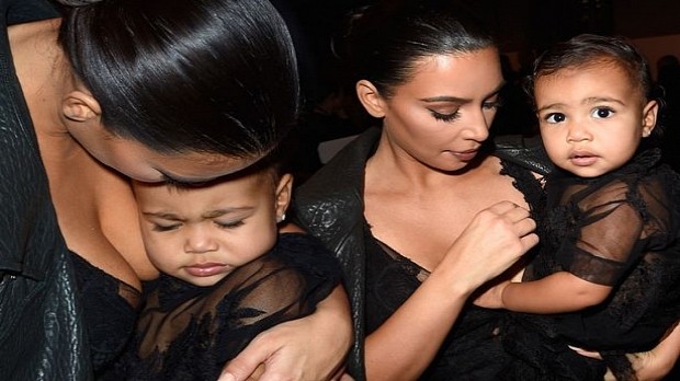 Doting mother Kim Kardashian snaps at husband Kanye when he physically educates their daughter