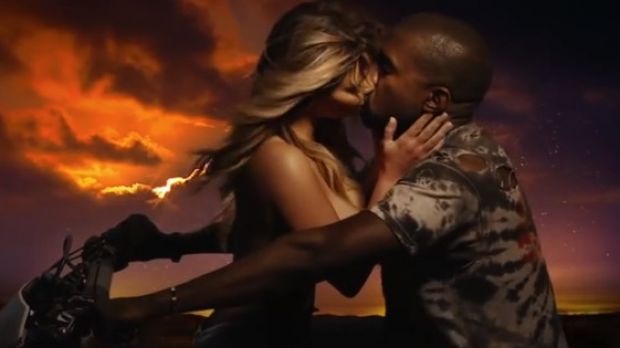 Kim Kardashian and Kanye West share a moment on a bike in “Bound 2” video