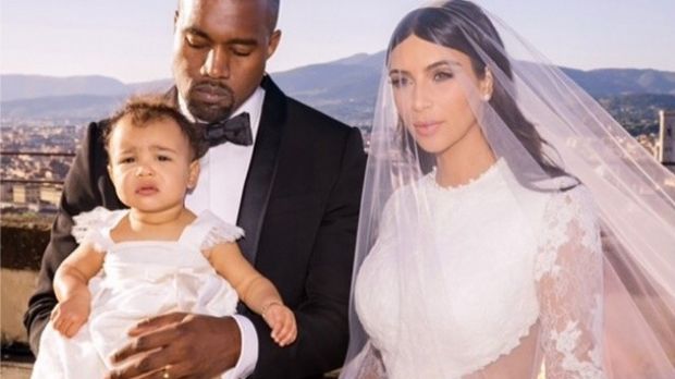 “My everything,” says Kim Kardashian of wedding photo with Kanye West and daughter North