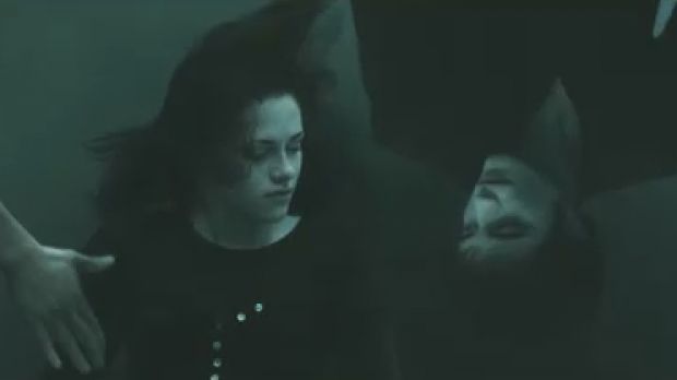 Scene from the trailer: Bella (Kristen Stewart) goes cliff diving to see Edward’s face (Robert Pattinson) again