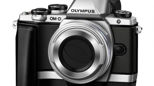 Olympus E-M10 with grip and 14-42mm f/3.5-5.6 lens attached