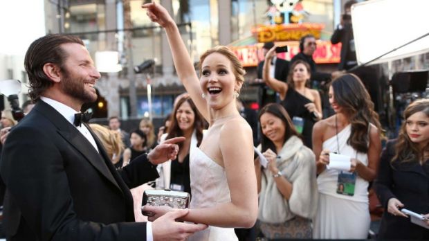 Jennifer Lawrence tries to divert attention to her co-star Bradley Cooper