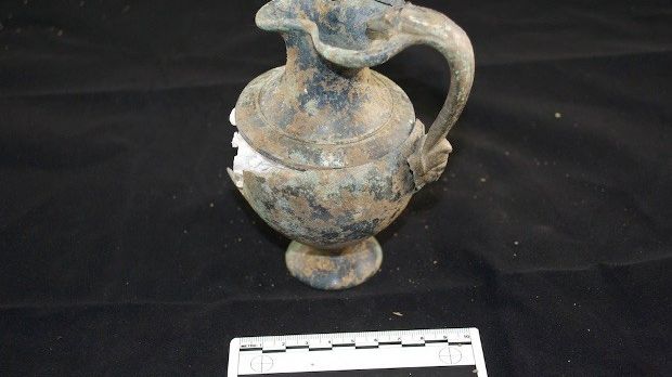 Bronze jug found inside the grave