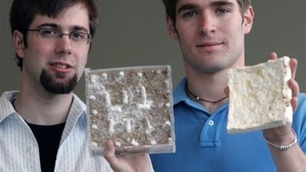 Gavin McIntyre, left, holds a growing sample of organic insulation, while Eben Bayer shows off the finished product, at Rensselaer Polytechnic Institute