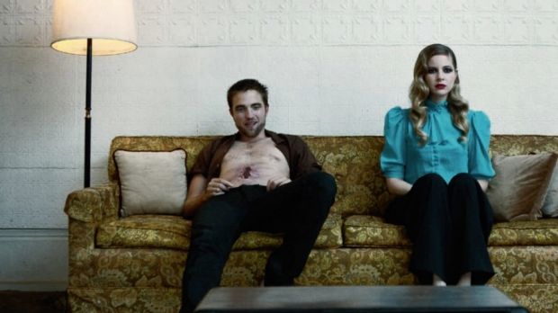 Robert Pattinson sports an open wound on his abdomen in new, freaky photospread