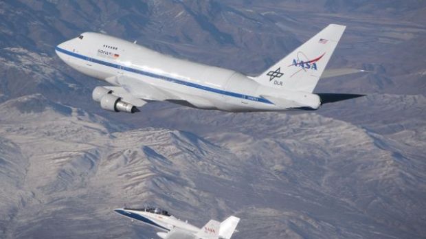 An F/A-18 mission support aircraft shadows NASA's Stratospheric Observatory for Infra-red Astronomy, or SOFIA, 747SP during a functional check flight
