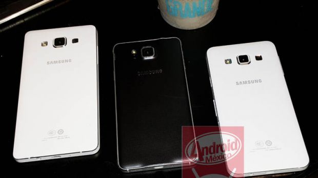 Samsung Galaxy Alpha flanked by Galaxy A5 (left) and Galaxy A3 (right)