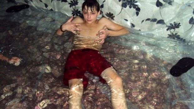 Teens use plastic sheeting to make indoor pool