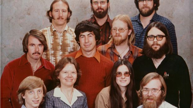 Front row (left to right): Bill Gates, Andrea Lewis, Marla Wood, and Paul Allen. Middle row: Bob O'Rear, Bob Greenberg, Marc McDonald, and Gordon Letwin. Back row: Steve Wood, Bob Wallace, and Jim Lane. Not pictured is Miriam Lubow.