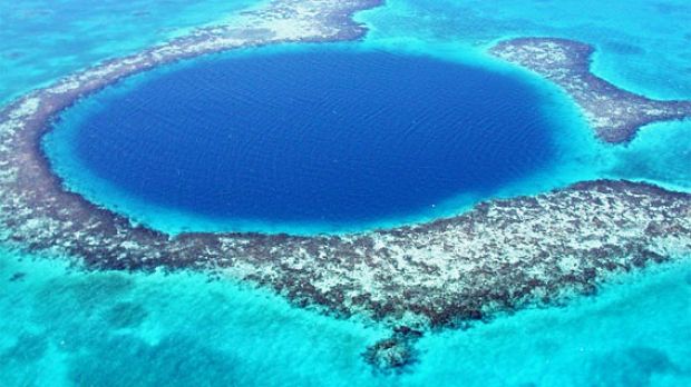 Blue Hole, a cenote (sinkhole) 120 m deep and 300 m wide in the Belize reefs