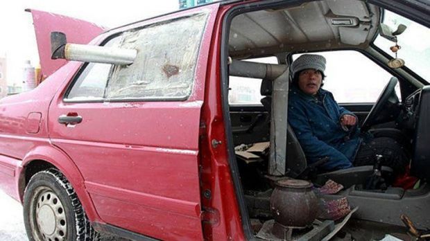 Woman in China has a stove in her car