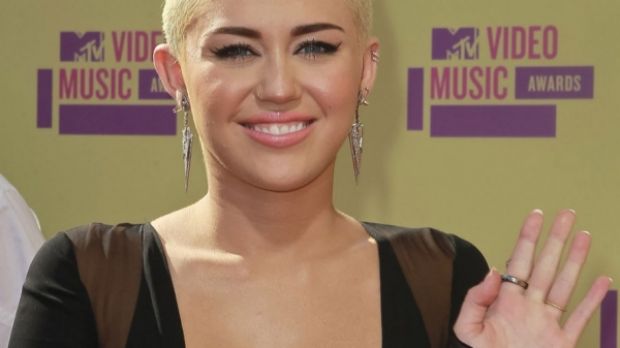 Miley Cyrus shows off new, tall, blonde mohawk at the VMAs 2012