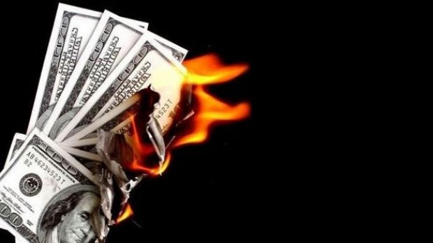 Woman mistakenly sets a whole lot of money on fire