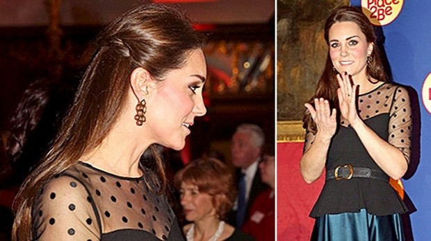 Kate Middleton shows off tiny baby bump