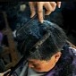 72-Year-Old Barber in China Uses Super Hot Metal Tongs to Cut Hair