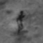 Alien-like Figure Photographed on the Surface of the Moon