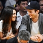 Ashton Kutcher Tries to Hide Pregnant Mila Kunis from the Paparazzi in New Video