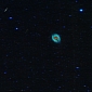 Asteroid Tracks Surround Helix Nebula in New WISE Image