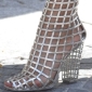 Beyonce Dons the $1,590 YSL Metallic Caged Boots