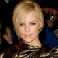 Charlize Theron in Paris, a Vision in Gold and Spiked Heels