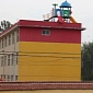 Chinese Toy Company Puts Kids Slide on Top of Building