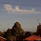 Clouds Form Image of Santa Claus Riding In on His Sleigh – Photo