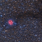Cocoon Nebula Bores Through Dust Cloud