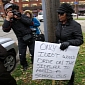 Driver Holds Up Idiot Sign, Her Punishment for Driving on the Sidewalk