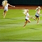 Girls Run on the Field at College World Series Game, Take Selfies